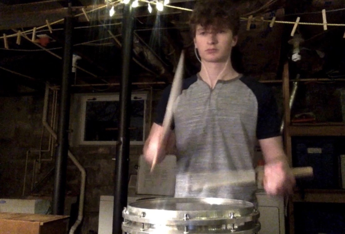 Boy playing a snare drum